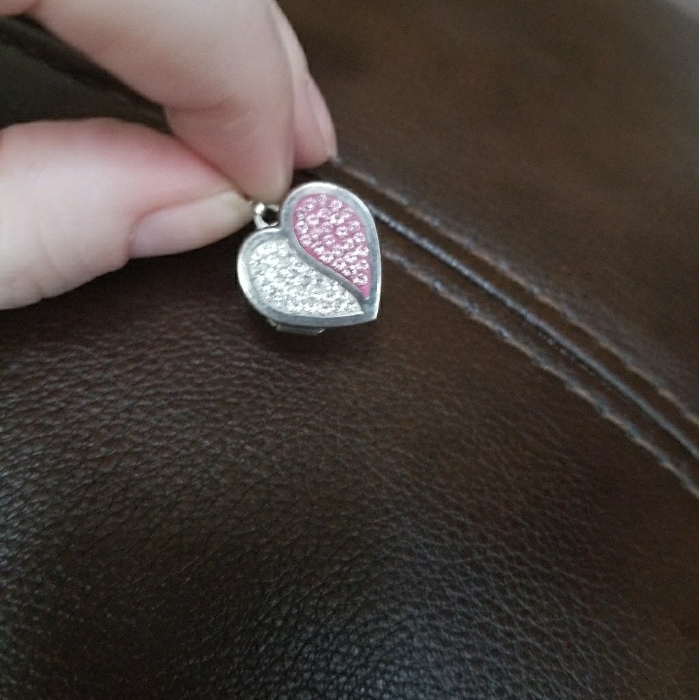 Super cute rhinestone locket.